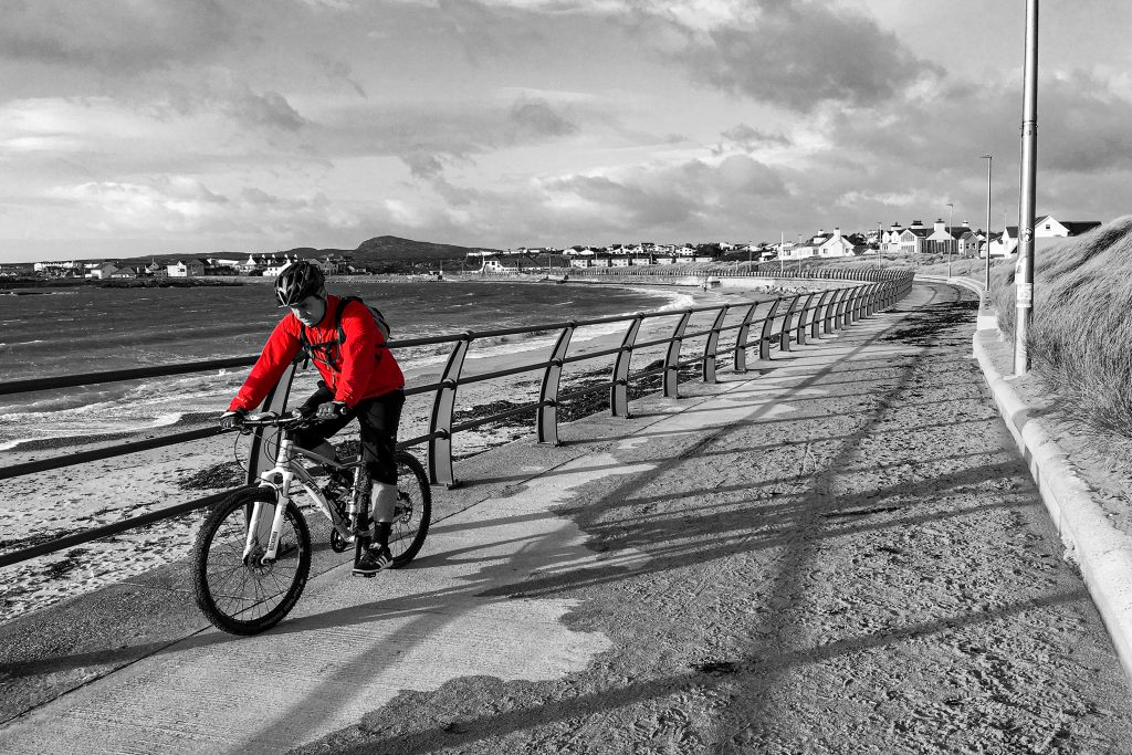 cyclist on promenade at trearddur bay