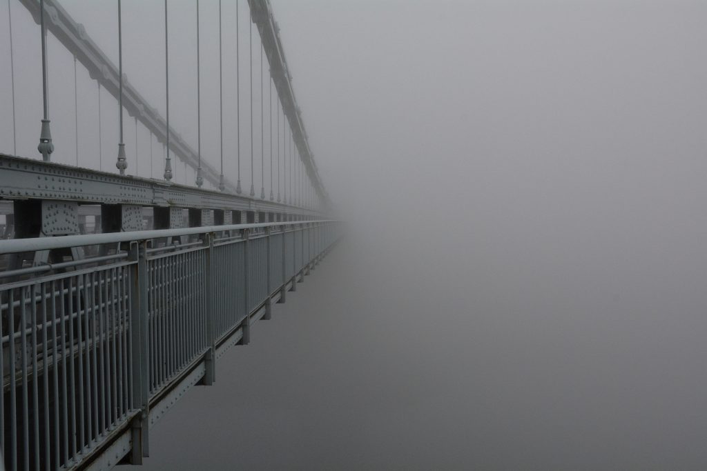 The Menai Suspension bridge disappears into the fog